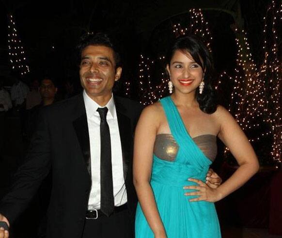 Parineeti Chopra in a blue and copper gown came to the party with Uday Chopra. 