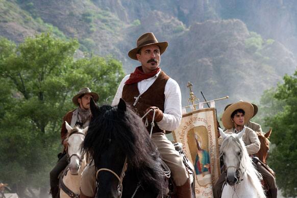 Andy Garcia, and, right, Mauricio Kuri with flag, are seen in the film 