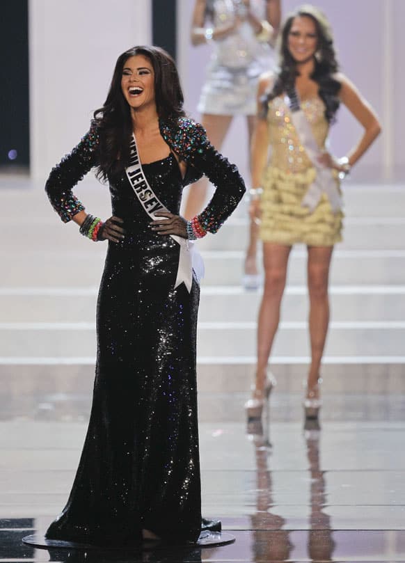 Miss New Jersey Michelle Leonardo, left, reacts as she is announced as one of the 16 finalists during the 2012 Miss USA pageant.