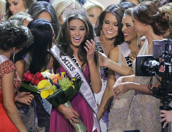 Miss Rhode Island Olivia Culpo, center, is surrounded by fellow contestants after being crowned Miss USA during the 2012 Miss USA pageant.