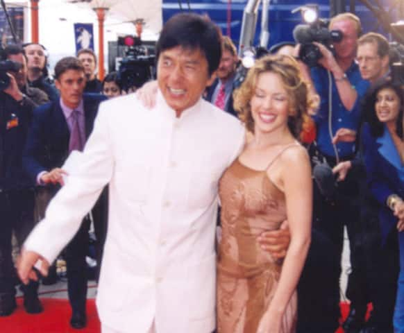 Jackie Chan and Kylie Minogue pose for the shutterbugs at IIFA 2000 which was held at Singapore. 