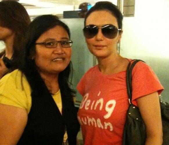 Preity Zinta got clicked with a fan on her arrival to Singapore for IFA 2012.