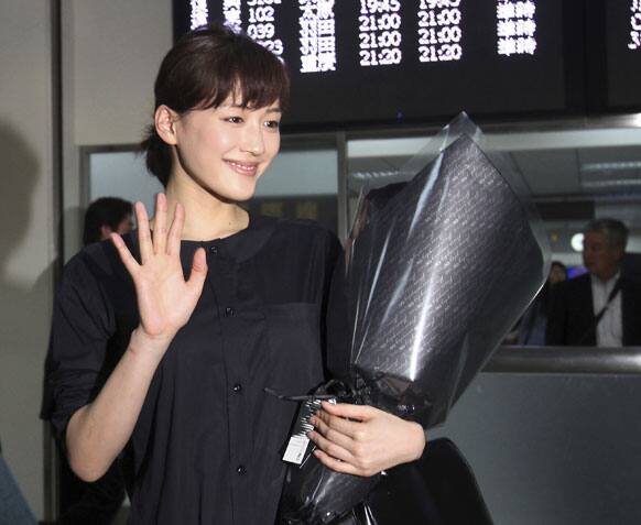 Japanese actress Haruka Ayase waves upon arrival at Taipei airport for a tour to promote her latest movie “Hotaru no Hikari - It’s Only Little Light In My Life” in Taipei, Taiwan.