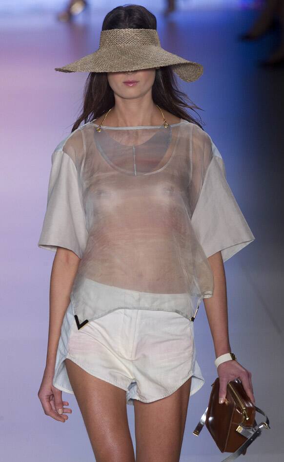 A model wears a creation from Osklen summer collection during the Sao Paulo Fashion Week in Sao Paulo.