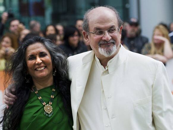 Director Deepa Mehta, left, and author Salman Rushdie pose for photographs on the red carpet for the new movie 