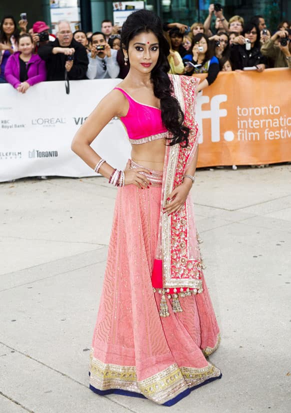 Actress Shriya Saran poses for photographs on he red carpet for the new movie 