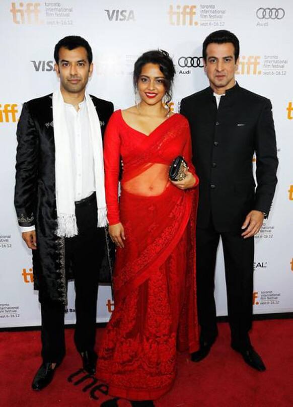 Shahana Goswami wears a red Sabyasachi Mukherjee sari for the screening of her new film, Deepa Mehta's 'Midnight's Children' at the Toronyo Film Festival. Seen here with her co stars in the film, Ronit Roy and Zaib Shaikh.