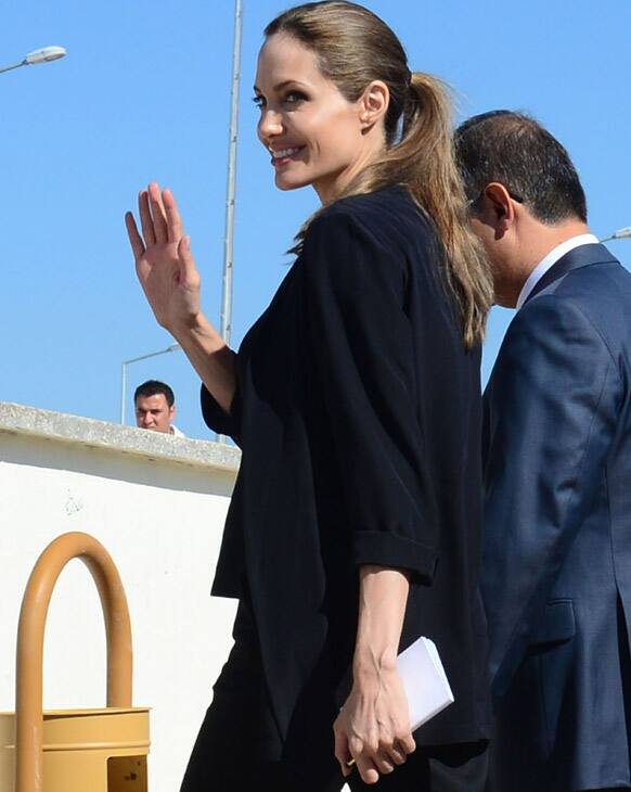 United Nations High Commissioner for Refugees (UNHCR) special envoy Angelina Jolie waves as she arrives at Oncupinar Syrian refugee camp in Kilis, Turkey.