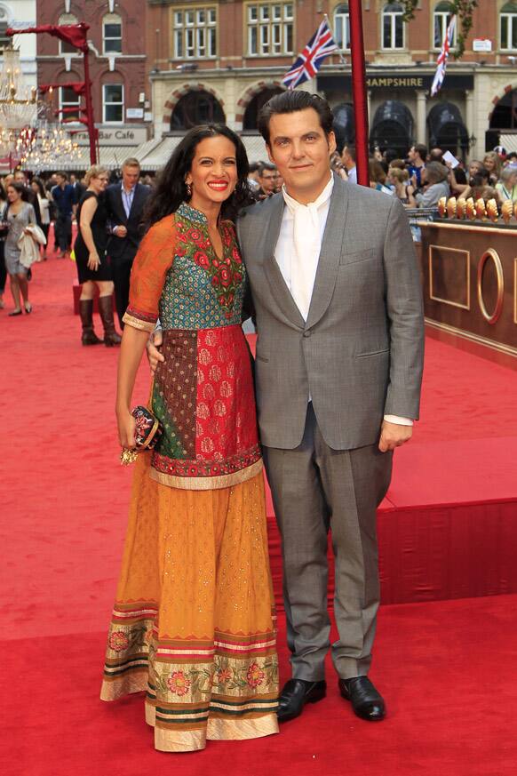 British film director Joe Wright and his wife sitarist Anoushka Shankar pose as they arrive for the world premiere of Anna Karenina in London.