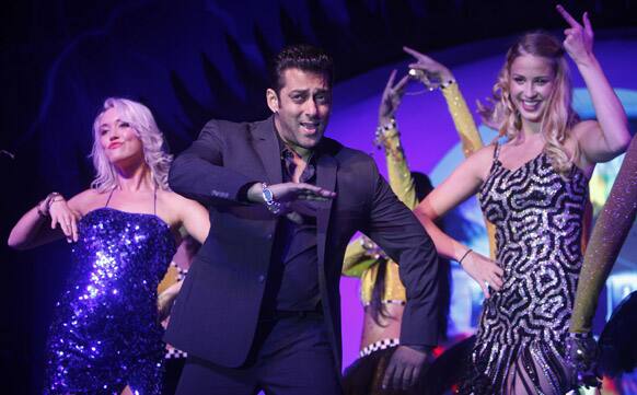 Bollywood actor Salman Khan, center, performs during an event to launch a television show 'Bigg Boss 6', in Mumbai.