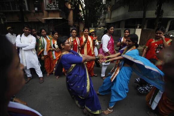 Hindu women dance during a procession ahead of the Ganesh Chaturti festival in Mumbai.