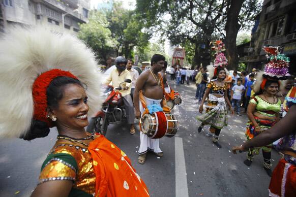 Folk dancers perform as they take part in a 