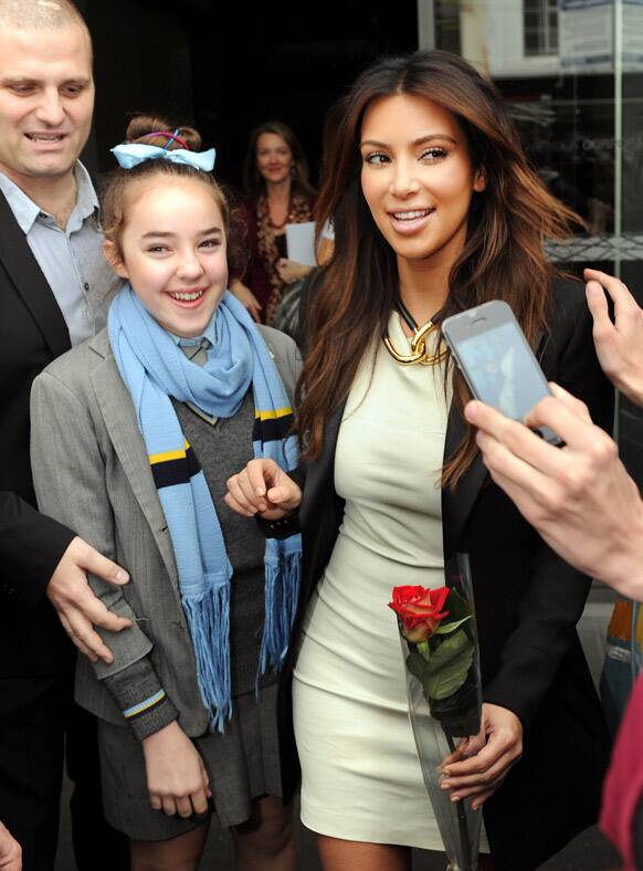 Kim Kardashian, meets with a 13-year-old school girl Helena Noonan-Barros as she leaves a radio station in Melbourne.