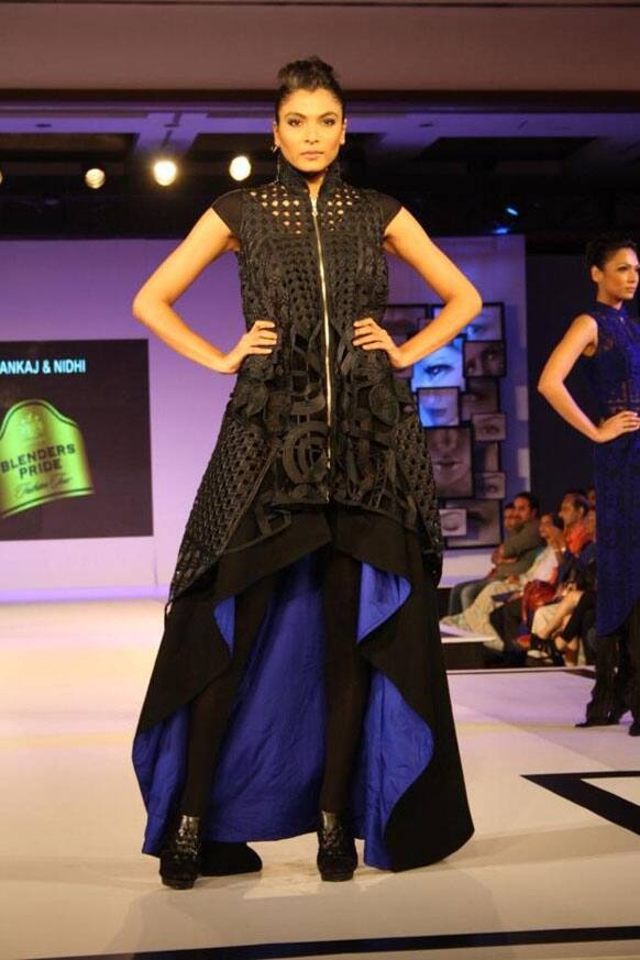 A model sashays down the ramp in a Pankaj & Nidhi creation.