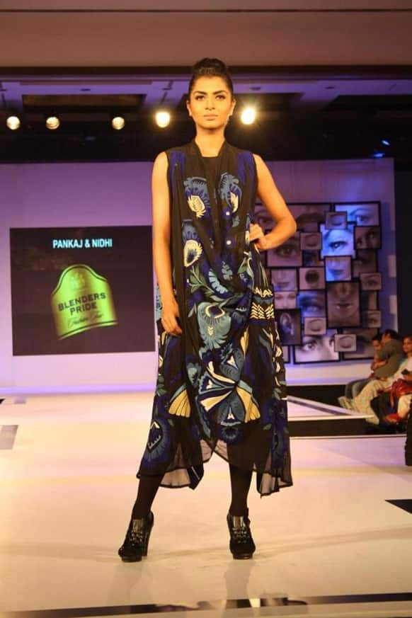 A model walks the ramp in a Pankaj & Nidhi creation.