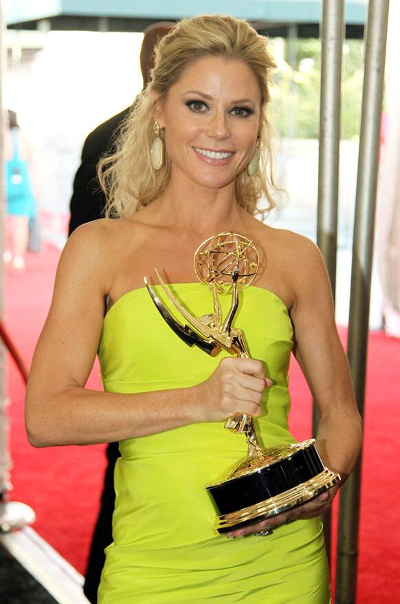 Actress Julie Bowen winner for Outstanding Supporting Actress in a Comedy Series poses backstage at the 64th Primetime Emmy Awards at the Nokia Theatre, in Los Angeles.