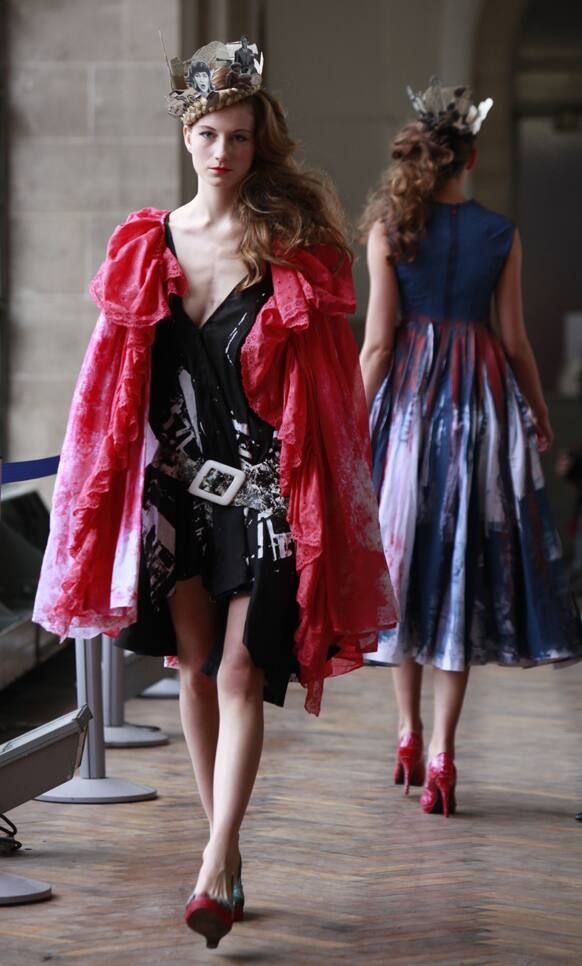 A model shows a creation by French fashion designer Karim Bonnet as part of Impasse de la Defense ready to wear Spring-Summer 2013 collection, presented in Paris.