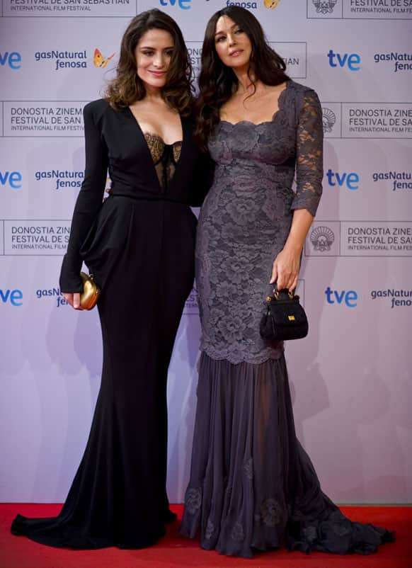 Italian actress Monica Bellucci poses beside Turk actress Belcim Bilgin on the red carpet to promote their film ''Rhino Season'', at the 60th San Sebastian Film Festival, in San Sebastian northern Spain.