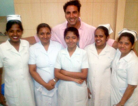 Bollywood actor Akshay Kumar smiles and poses for a click with the nurses of the maternity ward of the Breach Candy Hospital. Akshay's wife Twinkle delivered a baby girl in the same hospital.