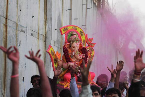 Hindus carry an idol of Hindu god Ganesha to immerse it in the river Sabarmati during the Ganesh Chaturthi festival in Ahmadabad.