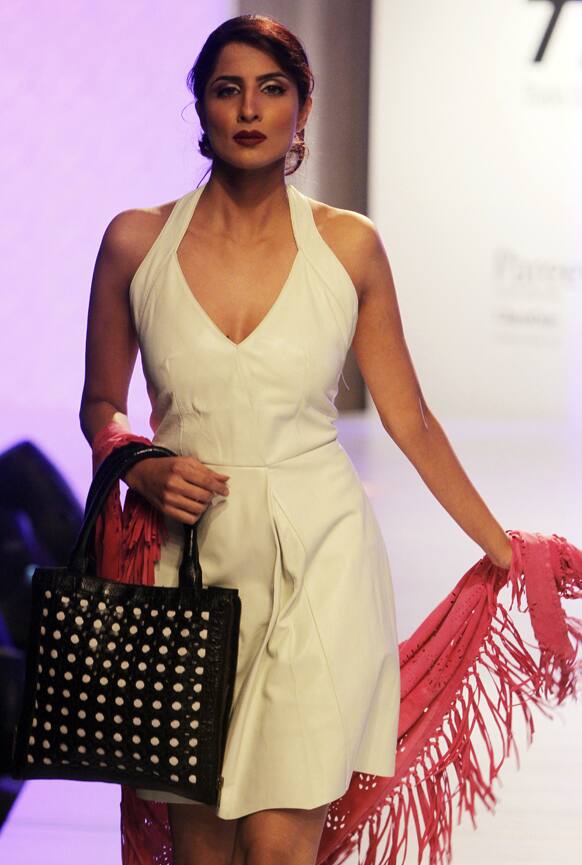 Pakistani models present creations by local designer Adnan Pardesy, during a fashion show in Karachi. The two-day fashion event is organized by the Trade Development Authority of Pakistan.