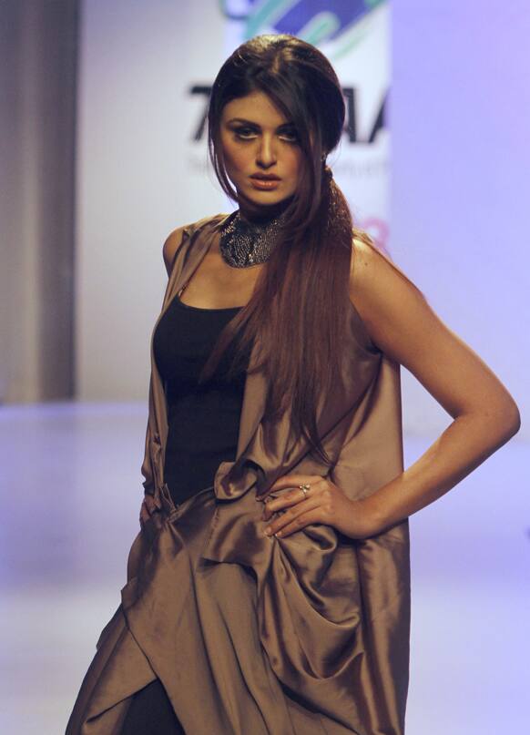 A model presents a creation by local designer Nida Khurram during a fashion show in Karachi, Pakistan.