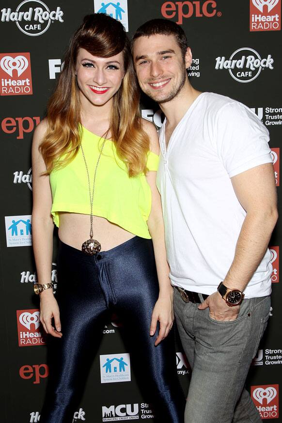 This photo released by Starpix shows Amy Heidemann and Nick Noonan, of Karmin, arriving at Hard Rock Rocks Times Square for an event to benefit St. Mary's Healthcare System for Children in New York.