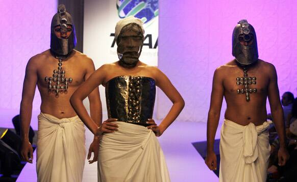 Pakistani models present creations by local designer Amin Gulgee, during a fashion show in Karachi. The two-day fashion event is organized by the Trade Development Authority of Pakistan.