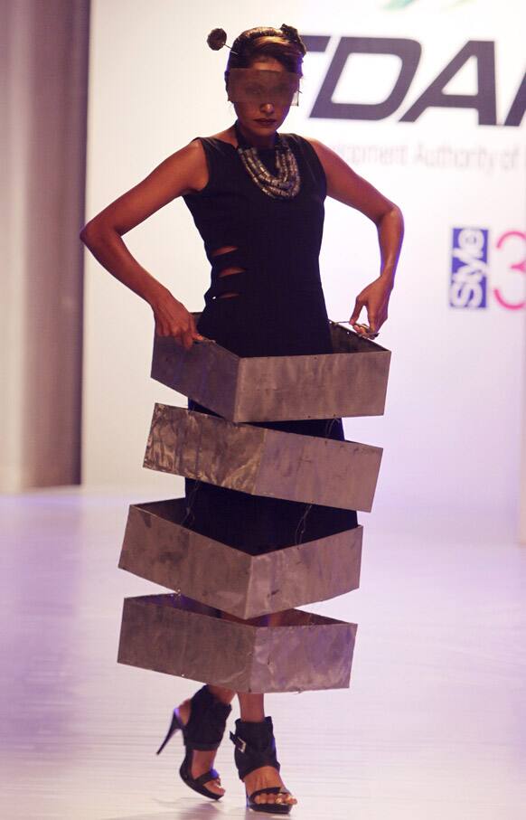 A model presents a creation by local designer Amin Gulgee, during a fashion show in Karachi. The two-day fashion event is organized by the Trade Development Authority of Pakistan.