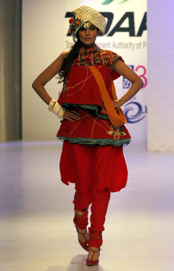 A model presents a creation by a local designer during a fashion show in Karachi. The two-day fashion event is organized by the Trade Development Authority of Pakistan.