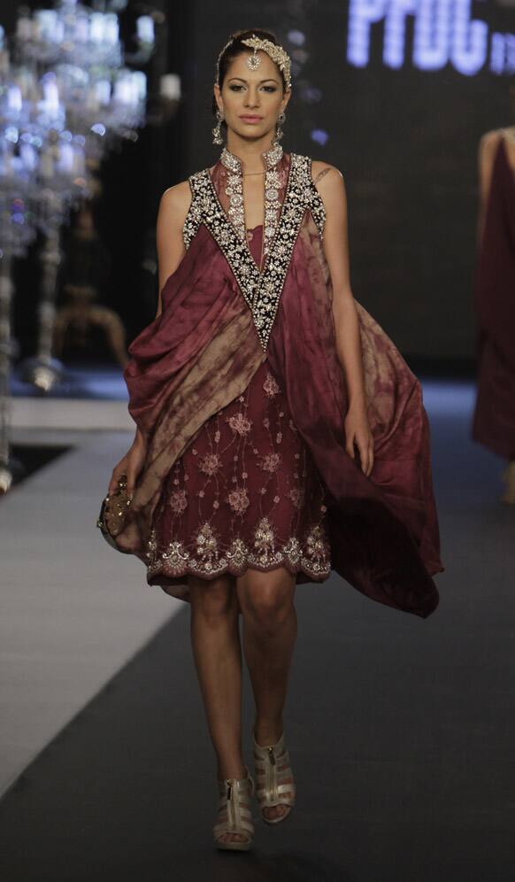 A model presents a creation by local designer Nickie Nina, during a fashion show in Karachi. The two-day fashion event is organized by the Trade Development Authority of Pakistan.