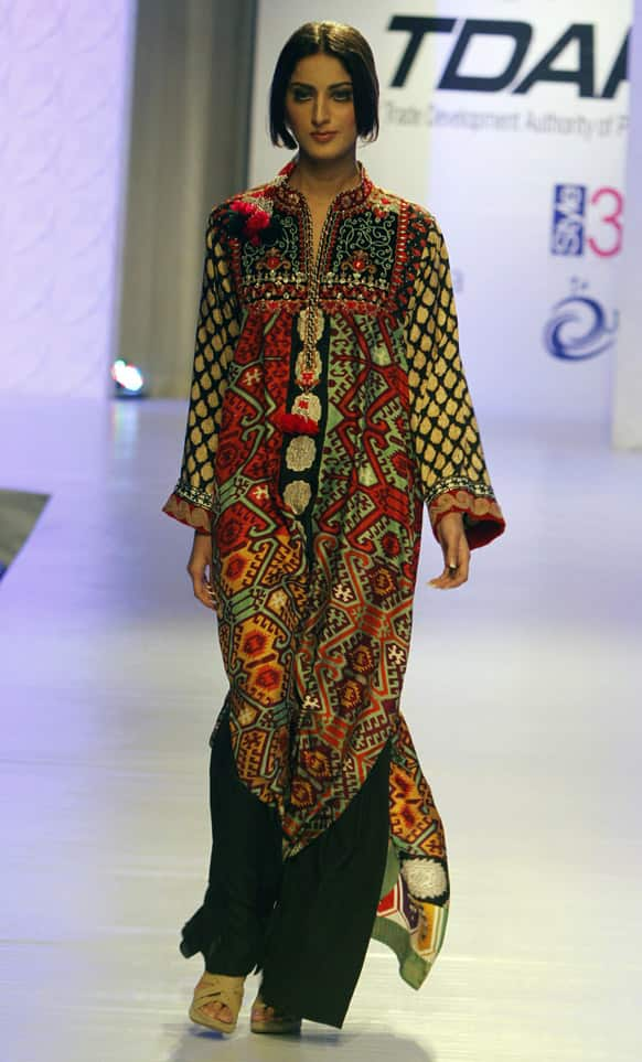 A model presents a creation by local designer Faiza Samee, during a fashion show in Karachi. The two-day fashion event is organized by the Trade Development Authority of Pakistan.