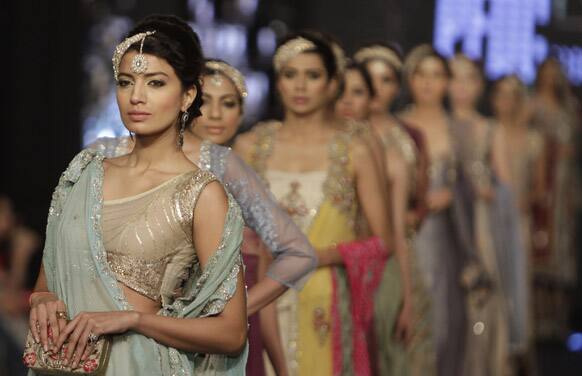 Models presents a creation by local designer Nickie Nina, during a fashion show in Karachi. The two-day fashion event is organized by the Trade Development Authority of Pakistan.