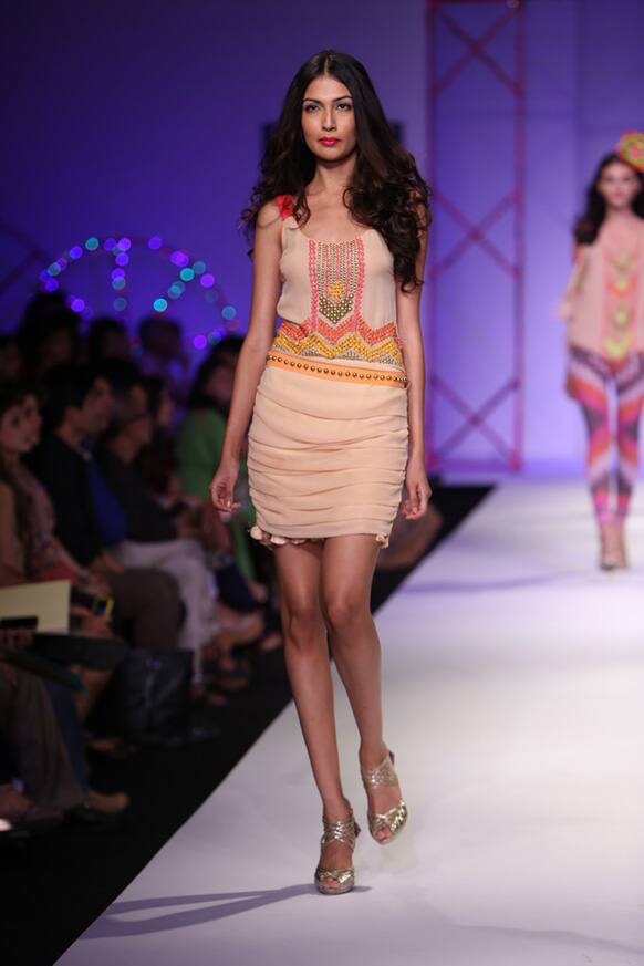 A model displays a creation by designer Surily.