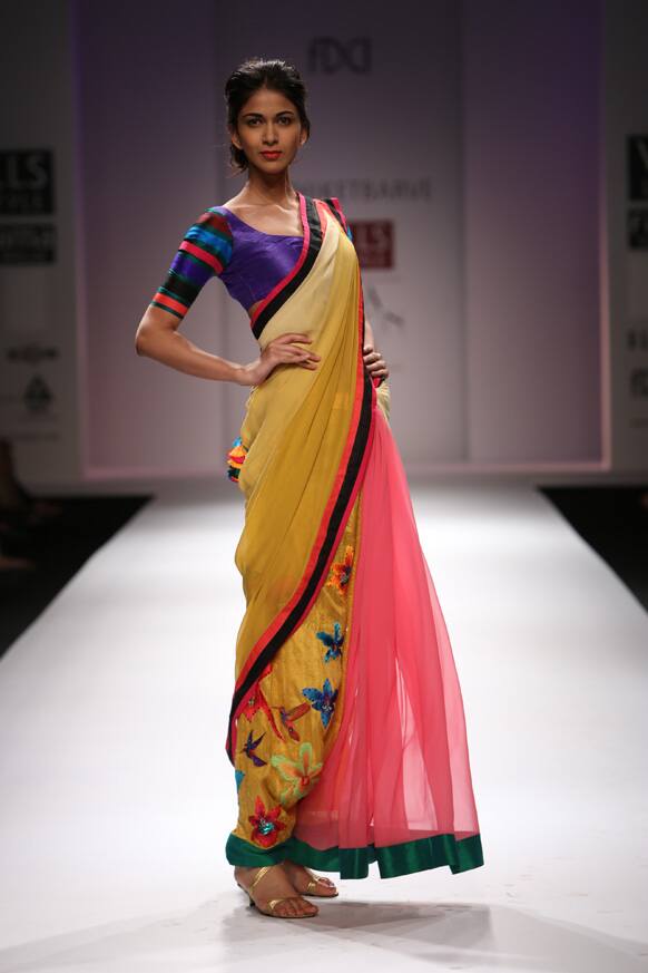 A model displays a creation by designer Nachiket Barve.