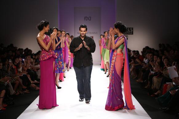 Designer Nachiket Barve with his models on the third day of the ongoing Wills Lifestyle India Fashion Week Spring Summer 2013.