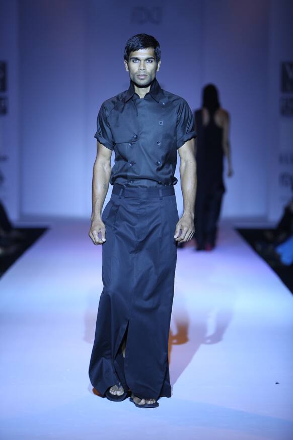 A model displays a collection from designer Arjun Saluja's 'Rishta'.