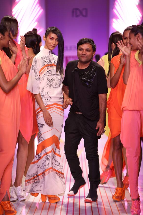 Designer Gaurav Gupta poses for a quick click with his models.