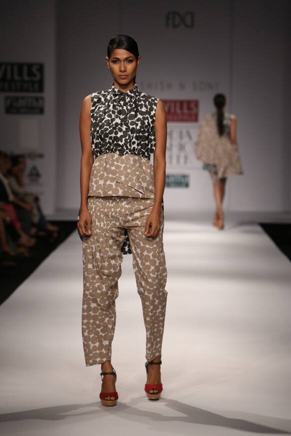 A model displays a creation by Ashish n Soni.