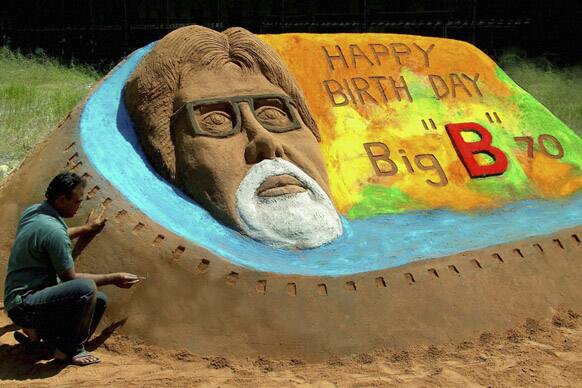 Artist Rajesh Muliya creates a sand sculpture of Bollywood's biggest star Amitabh Bachchan a day ahead of his 70th birthday, in Thangadh.