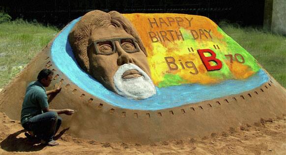 Artist Rajesh Muliya creates a sand sculpture of Bollywood's biggest star Amitabh Bachchan a day ahead of his 70th birthday, in Thangadh.