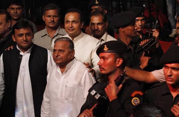 Anil Dhirubhai Ambani , puts his arms around CM of UP state Akhilesh Yadav and SP President Mulayam Singh Yadav during a party on the eve of Bollywood star Amitabh Abchchan’s 70th birthday in Mumbai.