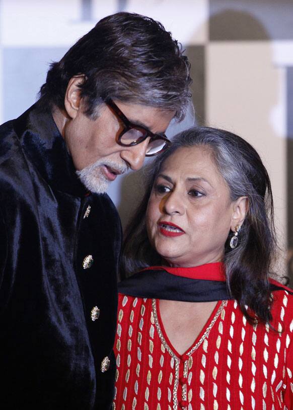 Bollywood star Amitabh Bachchan, listens to his wife Jaya Bachchan as they attend a party on the eve of his 70th birthday in Mumbai.