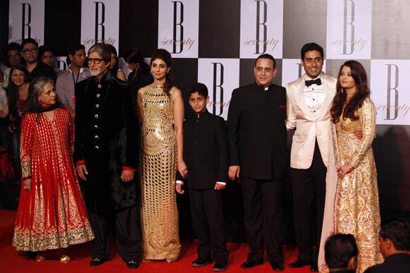 Bollywood star Amitabh Bachchan poses for photographers along with family members during a party on the eve of his 70th birthday in Mumbai.