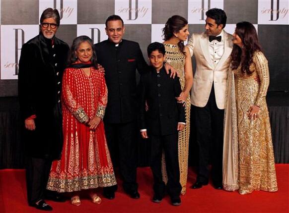 Amitabh Bachchan poses for photographers along with family members, wife Jaya Bachchan, son-in-law Nikhil Nanda, daughter Shweta Nanda, grandson Agastya, son Abhishek Bachchan, and daughter-in-law Aishwarya Rai-Bachchan during a party on the eve of his 70th birthday in Mumbai.