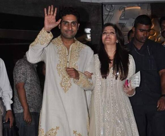 Abhishek Bachchan and Aishwarya Rai wave at the crowd outside Nehru Centre where an art exhbition is being held to celebrate Amitabh Bachchan's 70th birthday.