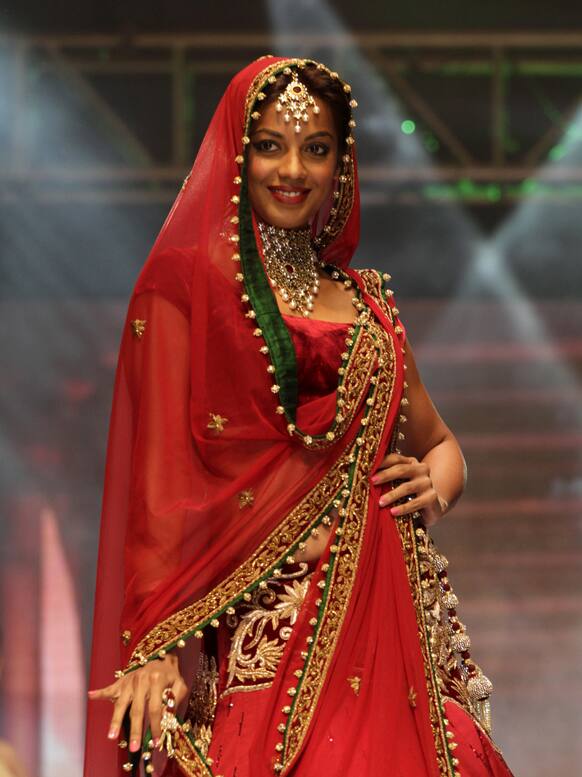 Bollywood actress Mugdha Godse displays a bridal wear during a bridal fashion show in Ahmadabad.