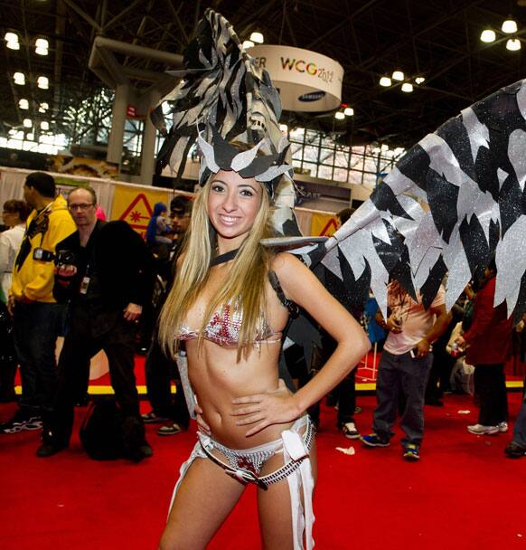 A costumed attendee poses on the floor of the New York Comic-Con fan convention in New York.