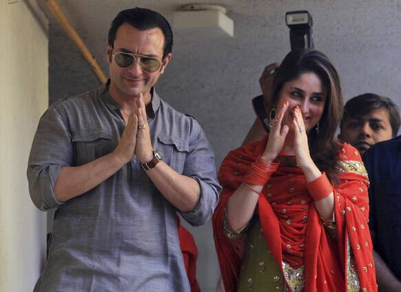 Bollywood stars Saif Ali Khan and Kareena Kapoor greet waiting fans after getting married in Mumbai.