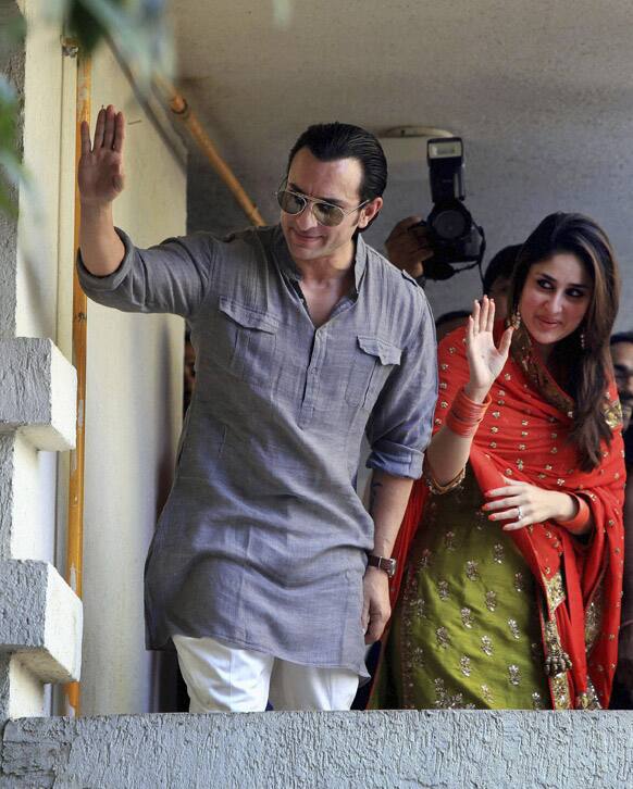 Bollywood stars Saif Ali Khan and Kareena Kapoor greet waiting fans after getting married in Mumbai.